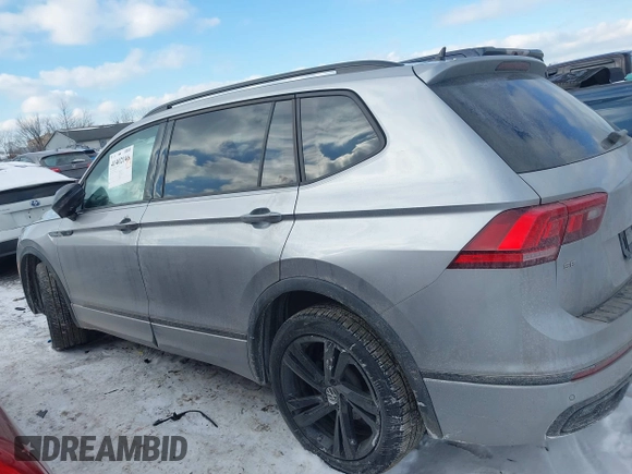 2023 Volkswagen Tiguan SE R-Line Black with VIN 3VV8B7AX3PM106873, listed as a IAAI auction lot 41402146 with 26,701 mi miles and . Bid and sale history available at DreamBid. Image 14.