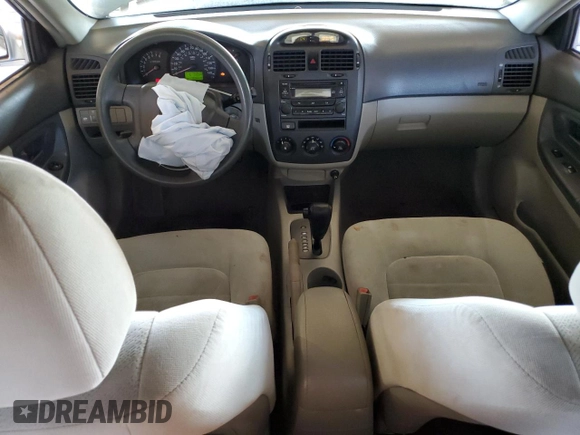 2006 Kia Spectra EX with VIN KNAFE121465332510, listed as a Copart auction lot 77211974 with 148,964 mi miles and Salvage Title. Bid and sale history available at carsss.com. Image 8.