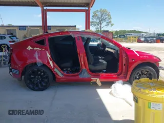 2020 Tesla Model Y Long Range with VIN 5YJYGDEE0LF029496, listed as a IAAI auction lot 41977695 with 47,958 mi miles and . Bid and sale history available at DreamBid. Image 12.