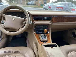 1995 Jaguar XJ with VIN SAJHX174XSC738291, listed as a Copart auction lot 87054224 with 71,076 mi miles and Clean title. Bid and sale history available at DreamBid. Image 9.