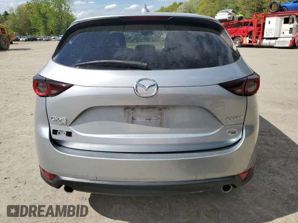 2021 Mazda CX-5 Touring z VIN JM3KFBCM1M0343804, wystawiony jako Copart lot #56194795 z przebiegiem 100 039 mil mil oraz Tytuł czysty. Historia ofert i sprzedaży dostępna na DreamBid. Obrazek 6.