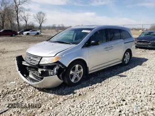 2012 Honda Odyssey Touring with VIN 5FNRL5H96CB083566, listed as a Copart auction lot 49414695 with 210,383 mi miles and Salvage Title. Bid and sale history available at carsss.com. Image 1.