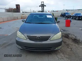 2004 Toyota Camry LE with VIN 4T1BF32K84U588764, listed as a IAAI auction lot 42126345 with 144,642 mi miles. Bid and sale history available at carsss.com. Image 12.