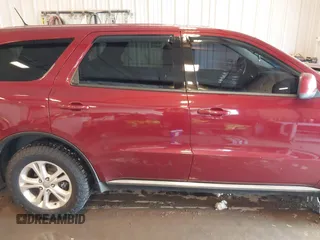2013 Dodge Durango SXT with VIN 1C4RDJAG4DC527945, listed as a IAAI auction lot 41590545 with 141,074 mi miles and . Bid and sale history available at DreamBid. Image 14.