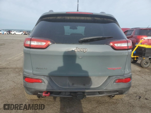 2014 Jeep Cherokee Trailhawk with VIN 1C4PJMBS3EW308706, listed as a Copart auction lot 58307975 with 90,530 mi miles and Salvage title. Bid and sale history available at DreamBid. Image 6.