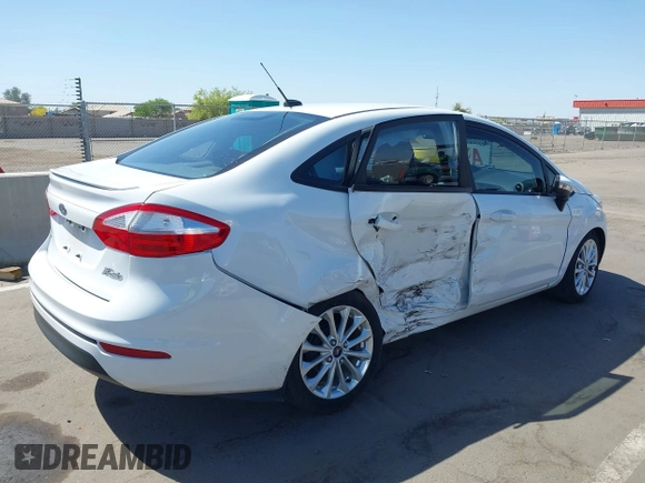 2014 Ford Fiesta SE z VIN 3FADP4BJ3EM183267, wystawiony jako IAAI lot #42058257 z przebiegiem 57 872 mil mil oraz . Historia ofert i sprzedaży dostępna na DreamBid. Obrazek 6.