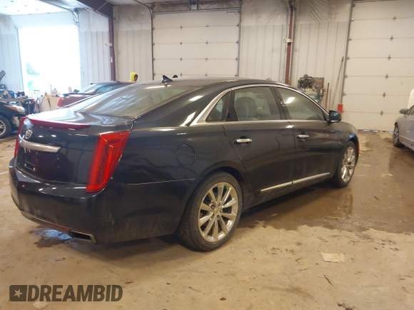 2014 Cadillac XTS Luxury with VIN 2G61M5S39E9325923, listed as a IAAI auction lot 41253343 with 69,319 mi miles. Bid and sale history available at carsss.com. Image 4.