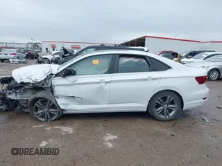 2021 Volkswagen Jetta S z VIN 3VWC57BUXMM017430, wystawiony jako IAAI lot #41947038 z przebiegiem 50 277 mil mil oraz . Historia ofert i sprzedaży dostępna na DreamBid. Obrazek 15.