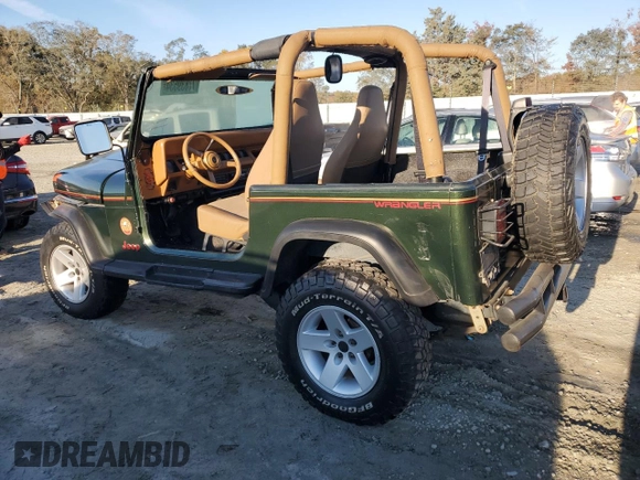 1995 Jeep Wrangler Sahara with VIN 1J4FY49S6SP272569, listed as a Copart auction lot 77839534 with 162,080 mi miles and Salvage Title. Bid and sale history available at carsss.com. Image 2.