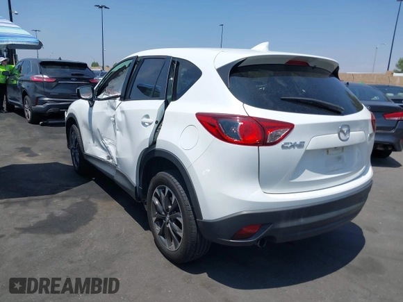 2016 Mazda CX-5 Grand Touring z VIN JM3KE2DY2G0824802, wystawiony jako IAAI lot #42170591 z przebiegiem 53 173 mil mil oraz . Historia ofert i sprzedaży dostępna na DreamBid. Obrazek 14.