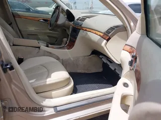 2003 Mercedes-Benz E-Class 3.2L with VIN WDBUF65J23A243178, listed as a IAAI auction lot 41974660 with 134,459 mi miles. Bid and sale history available at carsss.com. Image 5.