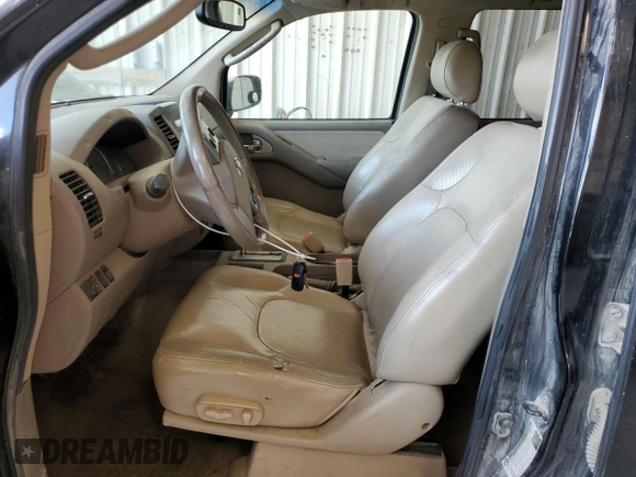 2009 Nissan Frontier LE with VIN 1N6AD09U79C409698, listed as a Copart auction lot 55843545 with 230,334 mi miles and Salvage title. Bid and sale history available at DreamBid. Image 7.