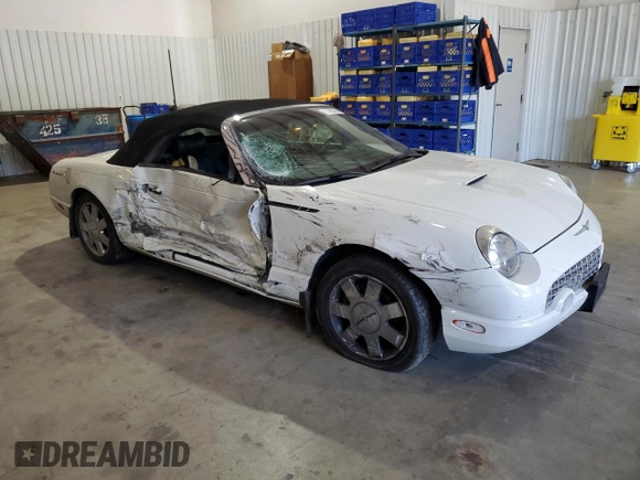 2002 Ford Thunderbird Hardtop Premium with VIN 1FAHP60A32Y125580, listed as a Copart auction lot 77493514 with 74,619 mi miles and Salvage Title. Bid and sale history available at DreamBid. Image 4.