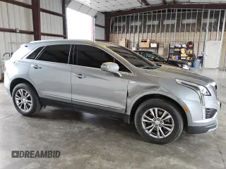 2023 Cadillac XT5 AWD Premium Luxury with VIN 1GYKNDR49PZ222592, listed as a Copart auction lot 79759624 with 32,177 mi miles and Clean Title. Bid and sale history available at DreamBid. Image 4.