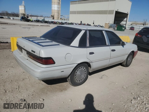 1992 Ford Tempo GL z VIN 2FAPP36XXNB207779, wystawiony jako Copart lot #49348685 z przebiegiem 526 491 mil mil oraz Czysty tytuł • Clean title. Historia ofert i sprzedaży dostępna na DreamBid. Obrazek 3.