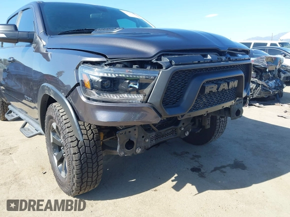 2022 Ram 1500 Rebel z VIN 1C6SRFLT4NN177112, wystawiony jako IAAI lot #42402050 z przebiegiem 26 239 mil mil oraz . Historia ofert i sprzedaży dostępna na DreamBid. Obrazek 6.