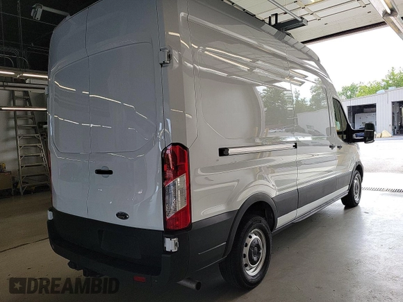 2023 Ford Transit Cargo with VIN 1FTBR1X86PKB99022, listed as a IAAI auction lot 42841650 with 14,234 mi miles and . Bid and sale history available at DreamBid. Image 16.