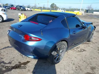 2020 Mazda MX-5 Miata Grand Touring z VIN JM1NDAM75L0412507, wystawiony jako IAAI lot #41573544 z przebiegiem Nie podano mil oraz . Historia ofert i sprzedaży dostępna na DreamBid. Obrazek 4.
