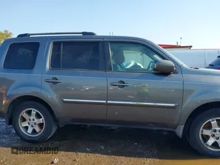 2010 Honda Pilot Touring with VIN 5FNYF3H87AB006023, listed as a IAAI auction lot 40310546 with 135,482 mi miles and . Bid and sale history available at carsss.com. Image 13.