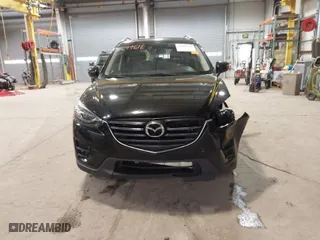 2016 Mazda CX-5 Grand Touring with VIN JM3KE2DY9G0635368, listed as a IAAI auction lot 41699616 with 240,619 mi miles. Bid and sale history available at carsss.com. Image 13.