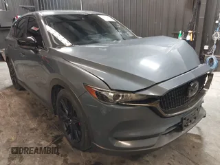 2021 Mazda CX-5 Touring with VIN JM3KFBCM5M0365725, listed as a IAAI auction lot 41411763 with 77,504 mi miles. Bid and sale history available at carsss.com. Image 1.