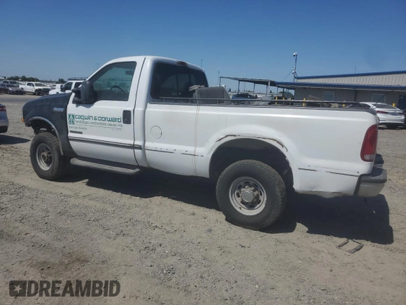 2000 Ford F-250 XL with VIN 1FTNF21F0YEC85459, listed as a Copart auction lot 63040505 with 328,049 mi miles and Salvage title. Bid and sale history available at DreamBid. Image 2.