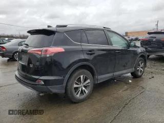 2018 Toyota RAV4 XLE with VIN 2T3RFREVXJW723057, listed as a Copart auction lot 49176705 with 5,980 mi miles and Salvage Title. Bid and sale history available at DreamBid. Image 3.