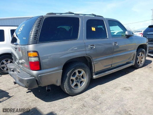 2005 GMC Yukon Denali with VIN 1GKEK63U35J149963, listed as a IAAI auction lot 41829530 with 243,575 mi miles. Bid and sale history available at carsss.com. Image 4.