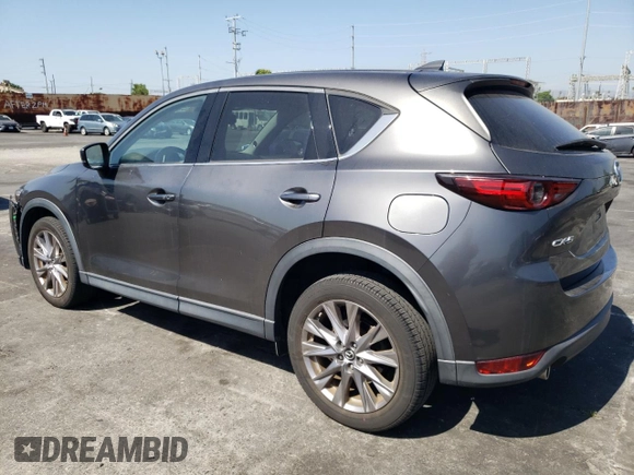 2019 Mazda CX-5 Grand Touring with VIN JM3KFADM6K1641992, listed as a Copart auction lot 57862345 with 37,100 mi miles and Salvage title. Bid and sale history available at DreamBid. Image 2.
