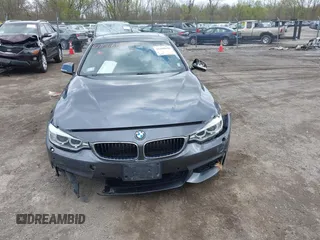2015 BMW 4 Series 428i xDrive z VIN WBA4A7C5XFD415131, wystawiony jako IAAI lot #42100618 z przebiegiem 89 093 mil mil oraz . Historia ofert i sprzedaży dostępna na DreamBid. Obrazek 12.
