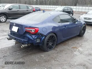 2017 Toyota 86 with VIN JF1ZNAA12H9703408, listed as a IAAI auction lot 41311374 with 90,661 mi miles. Bid and sale history available at carsss.com. Image 4.