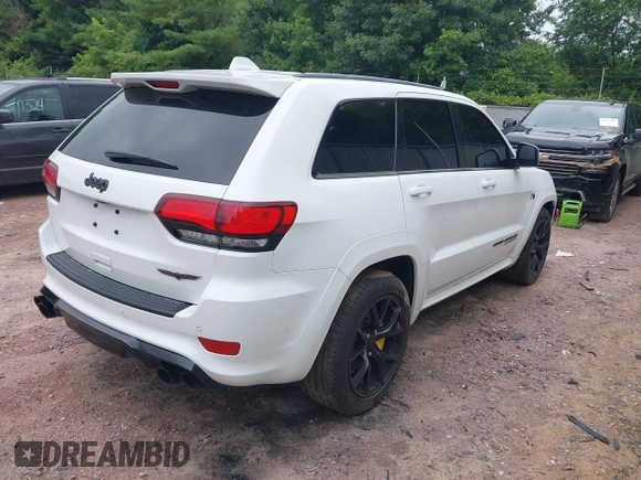 2021 Jeep Grand Cherokee Trackhawk with VIN 1C4RJFN95MC843131, listed as a IAAI auction lot 42688185 with 16,391 mi miles and . Bid and sale history available at DreamBid. Image 4.