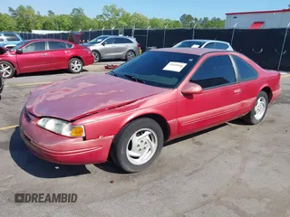 1996 Ford Thunderbird LX with VIN 1FALP62W0TH142986, listed as a IAAI auction lot 42030900 with 168,993 mi miles. Bid and sale history available at carsss.com. Image 2.