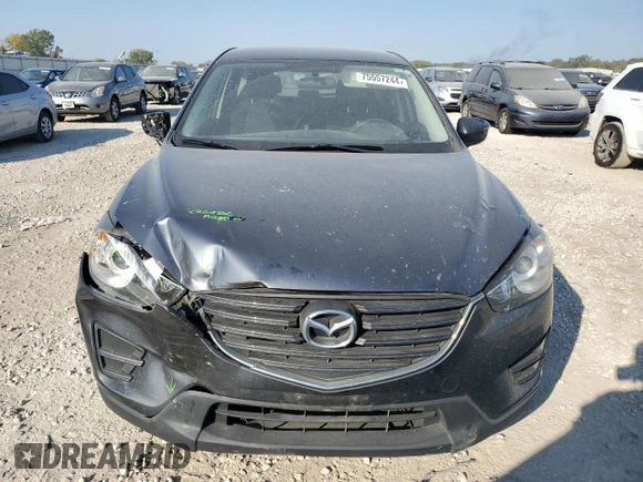 2016 Mazda CX-5 Sport with VIN JM3KE2BE7G0739544, listed as a Copart auction lot 75557244 with 128,336 mi miles and Salvage Title. Bid and sale history available at DreamBid. Image 5.