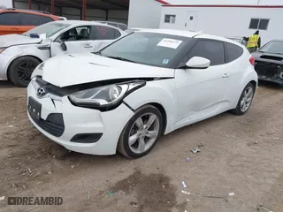 2014 Hyundai Veloster with VIN KMHTC6AD6EU211479, listed as a IAAI auction lot 41196275 with 132,337 mi miles. Bid and sale history available at carsss.com. Image 2.