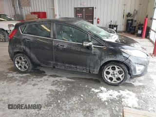 2011 Ford Fiesta SES with VIN 3FADP4FJ7BM196559, listed as a IAAI auction lot 41527976 with 65,861 mi miles. Bid and sale history available at carsss.com. Image 1.