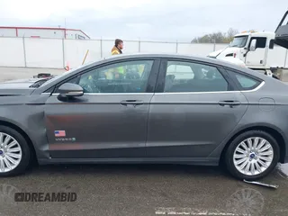 2015 Ford Fusion SE Hybrid with VIN 3FA6P0LU9FR232583, listed as a IAAI auction lot 42012175 with 139,309 mi miles and . Bid and sale history available at DreamBid. Image 14.