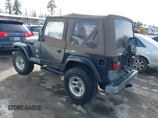 1999 Jeep Wrangler Sahara with VIN 1J4FY49S9XP410760, listed as a IAAI auction lot 41647187 with 181,353 mi miles. Bid and sale history available at carsss.com. Image 3.