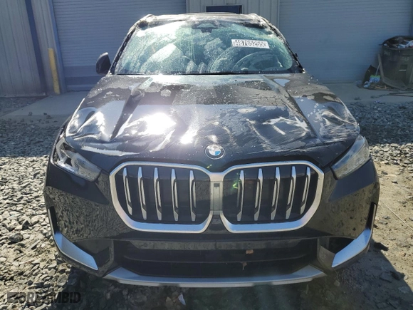 2025 BMW X1 xDrive28i with VIN WBX73EF00S5111795, listed as a Copart auction lot 48765255 with 12,042 mi miles and Salvage Title. Bid and sale history available at carsss.com. Image 5.