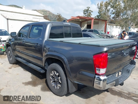 2017 Toyota Tacoma SR5 with VIN 3TMAZ5CN6HM050456, listed as a IAAI auction lot 38968606 with 48,576 mi miles and . Bid and sale history available at DreamBid. Image 3.