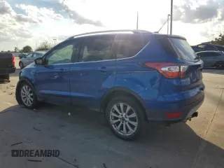 2017 Ford Escape Titanium with VIN 1FMCU0JD2HUB21261, listed as a Copart auction lot 76607264 with 130,796 mi miles and Salvage Title. Bid and sale history available at carsss.com. Image 2.