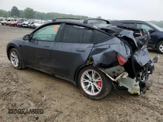 2023 Tesla Model Y Long Range z VIN 7SAYGDEE7PF870370, wystawiony jako Copart lot #55700135 z przebiegiem 32 410 mil mil oraz Szkoda całkowita • Salvage title. Historia ofert i sprzedaży dostępna na DreamBid. Obrazek 2.
