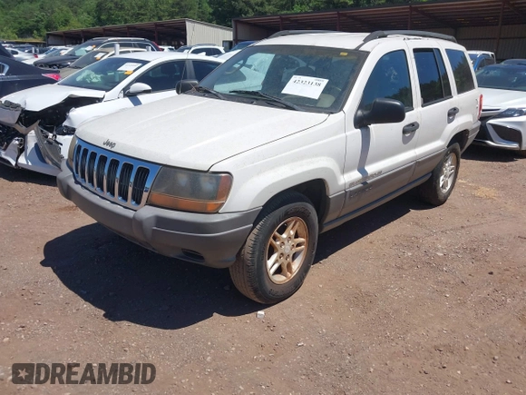 2002 Jeep Grand Cherokee Laredo with VIN 1J4GX48S32C134911, listed as a IAAI auction lot 42323138 with 156,852 mi miles and . Bid and sale history available at DreamBid. Image 2.