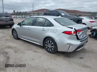 2020 Toyota Corolla Hybrid LE with VIN JTDEBRBE1LJ008409, listed as a IAAI auction lot 41948940 with 102,402 mi miles. Bid and sale history available at carsss.com. Image 3.