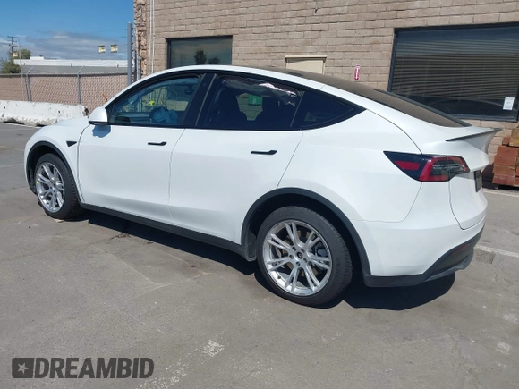 2023 Tesla Model Y Long Range with VIN 7SAYGDEE2PF696336, listed as a IAAI auction lot 41894686 with 34,203 mi miles. Bid and sale history available at carsss.com. Image 3.