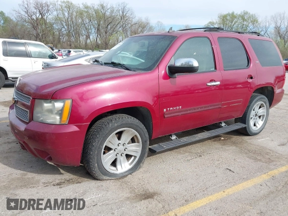 2007 Chevrolet Tahoe LTZ with VIN 1GNFK130X7R319974, listed as a IAAI auction lot 41955206 with 187,445 mi miles and . Bid and sale history available at DreamBid. Image 2.