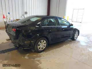 2017 Volkswagen Jetta 1.4T S with VIN 3VW167AJ5HM329706, listed as a IAAI auction lot 40801058 with 144,103 mi miles. Bid and sale history available at carsss.com. Image 4.