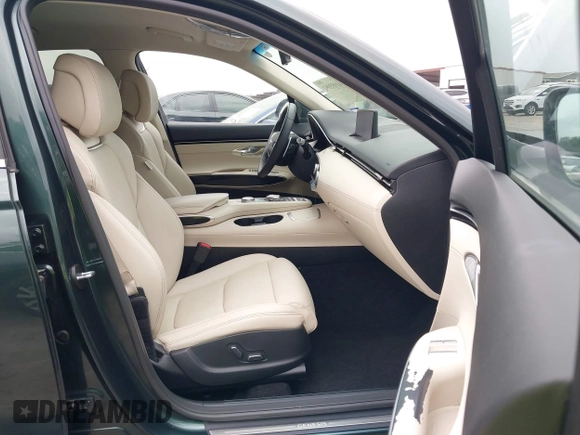 2022 Genesis GV70 2.5T with VIN KMUMADTB1NU065388, listed as a IAAI auction lot 41955992 with 23,134 mi miles and . Bid and sale history available at DreamBid. Image 5.
