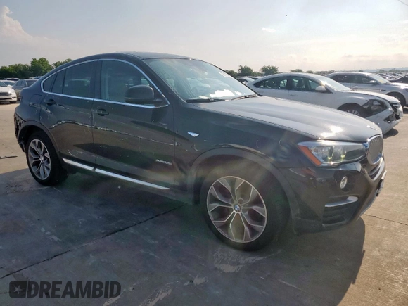 2015 BMW X4 xDrive28i with VIN 5UXXW3C52F0M87621, listed as a Copart auction lot 59176505 with 163,727 mi miles and Salvage title. Bid and sale history available at DreamBid. Image 4.