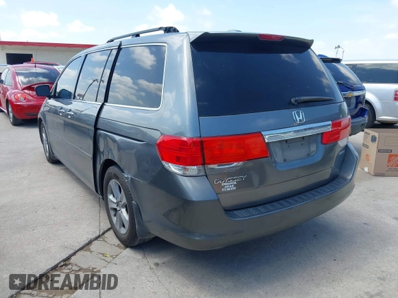 2010 Honda Odyssey Touring with VIN 5FNRL3H90AB053710, listed as a IAAI auction lot 42577646 with 255,351 mi miles and . Bid and sale history available at DreamBid. Image 3.